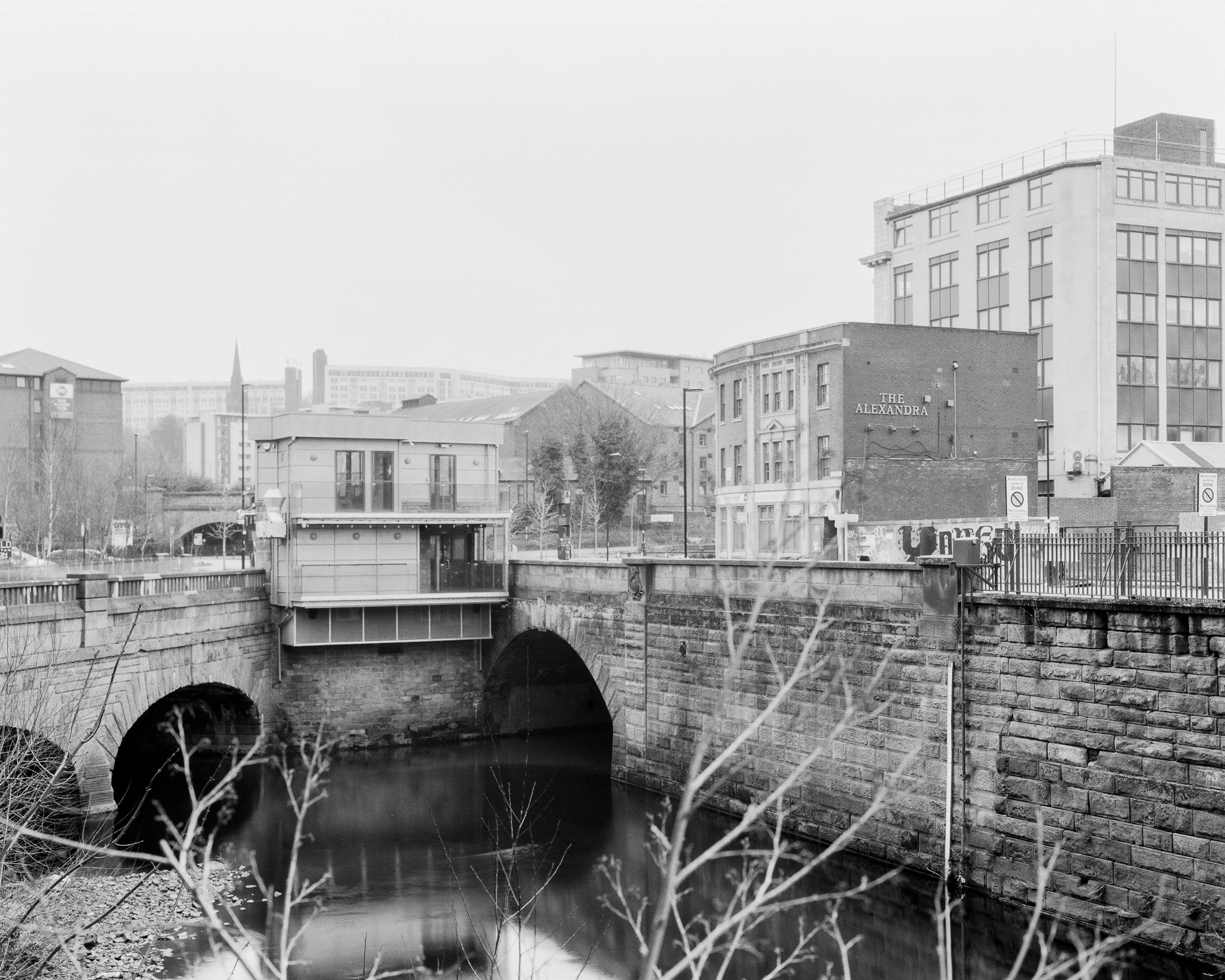 Photograph of River Sheaf meeting the River Don at Two Rivers Cafe, Sheffield. Black and White image shot on Kodak 5x4 Gravure Film. © 2023 Jonny Sutton. 